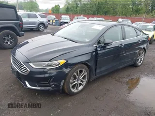 2020 Ford Fusion SEL z VIN 3FA6P0CD9LR183400, wystawiony jako IAAI lot #42271491 z przebiegiem 52 020 mil mil oraz . Historia ofert i sprzedaży dostępna na DreamBid. Obrazek 2.