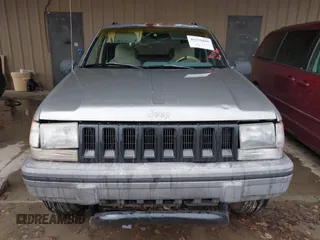 1995 Jeep Grand Cherokee Laredo with VIN 1J4GZ58SXSC697003, listed as a IAAI auction lot 41259889 with 248,595 mi miles. Bid and sale history available at carsss.com. Image 6.