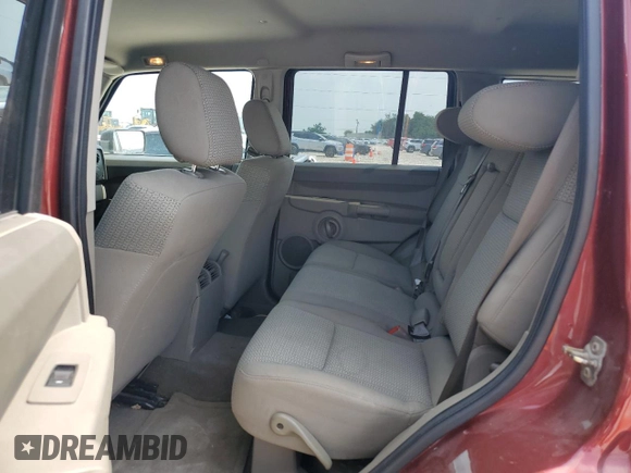 2006 Jeep Commander z VIN 1J8HH48K66C369227, wystawiony jako Copart lot #53723565 z przebiegiem 193 303 mil mil oraz Szkoda całkowita • Salvage title. Historia ofert i sprzedaży dostępna na DreamBid. Obrazek 11.