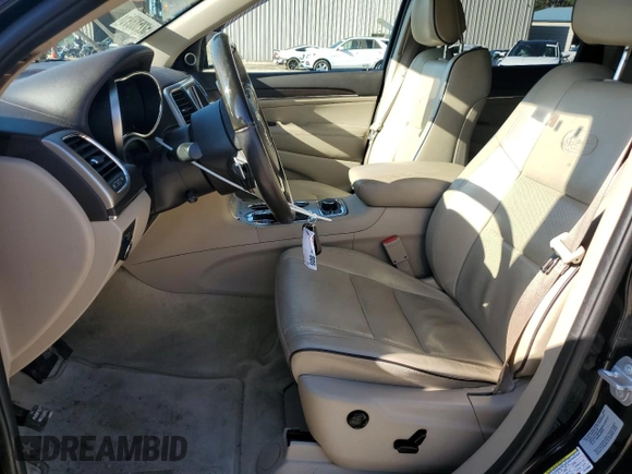 2017 Jeep Grand Cherokee Overland with VIN 1C4RJFCT3HC755960, listed as a Copart auction lot 52268895 with 99,998 mi miles and Salvage title. Bid and sale history available at DreamBid. Image 7.