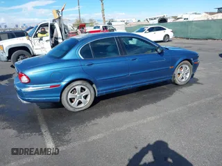 2002 Jaguar X-Type with VIN SAJEA51C42WC11103, listed as a IAAI auction lot 41699366 with 106,418 mi miles and . Bid and sale history available at DreamBid. Image 4.