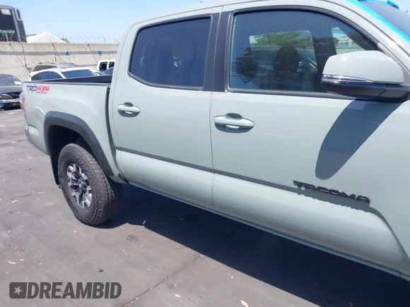 2023 Toyota Tacoma SR with VIN 3TMCZ5AN3PM590101, listed as a IAAI auction lot 42338670 with 12,970 mi miles and . Bid and sale history available at DreamBid. Image 13.