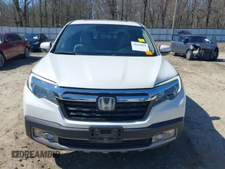 2020 Honda Ridgeline RTL-E with VIN 5FPYK3F75LB000317, listed as a IAAI auction lot 41850029 with 17,430 mi miles and . Bid and sale history available at DreamBid. Image 13.