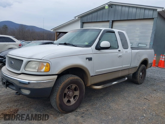 1999 Ford F-150 XL with VIN 1FTRX18LXXKA75357, listed as a IAAI auction lot 41630371 with 202,021 mi miles. Bid and sale history available at carsss.com. Image 6.