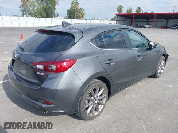 2018 Mazda 3 Touring with VIN 3MZBN1L32JM268582, listed as a IAAI auction lot 42072435 with 61,417 mi miles. Bid and sale history available at carsss.com. Image 4.