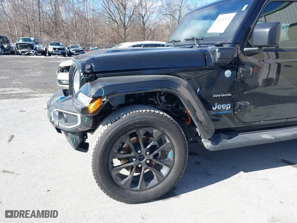 2023 Jeep Wrangler 4xe Sahara with VIN 1C4JJXP62PW613040, listed as a IAAI auction lot 41489171 with 36,818 mi miles. Bid and sale history available at carsss.com. Image 18.