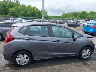 2019 Honda Fit LX z VIN 3HGGK5H42KM748117, wystawiony jako IAAI lot #42190794 z przebiegiem 54 614 mil mil oraz . Historia ofert i sprzedaży dostępna na DreamBid. Obrazek 14.