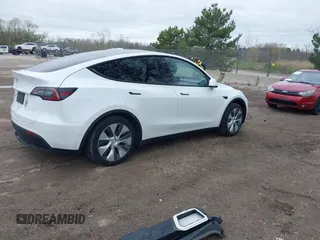 2022 Tesla Model Y Long Range with VIN 7SAYGDEE1NF421098, listed as a IAAI auction lot 42177555 with 55,855 mi miles and . Bid and sale history available at carsss.com. Image 4.