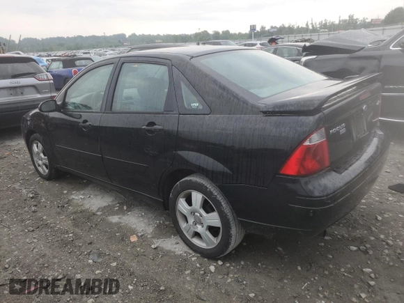 2005 Ford Focus S with VIN 1FAFP34N45W285454, listed as a Copart auction lot 59043485 with 165,071 mi miles and Salvage title. Bid and sale history available at DreamBid. Image 2.