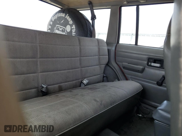 1996 Jeep Cherokee SE with VIN 1J4FT28S3TL213153, listed as a Copart auction lot 57217625 with 331,741 mi miles and Salvage title. Bid and sale history available at DreamBid. Image 11.