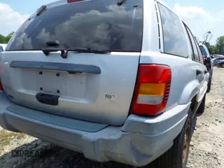 2002 Jeep Grand Cherokee Laredo with VIN 1J4GW48SX2C313093, listed as a IAAI auction lot 42446559 with 200,319 mi miles and . Bid and sale history available at DreamBid. Image 18.