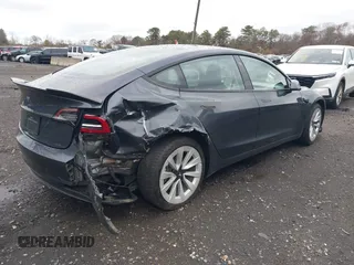 2022 Tesla Model 3 with VIN 5YJ3E1EA6NF143839, listed as a IAAI auction lot 40905007 with 83,897 mi miles and . Bid and sale history available at DreamBid. Image 4.
