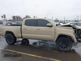 2016 Toyota Tacoma SR5 with VIN 3TMDZ5BN3GM003351, listed as a IAAI auction lot 41721932 with 100,774 mi miles and . Bid and sale history available at DreamBid. Image 14.