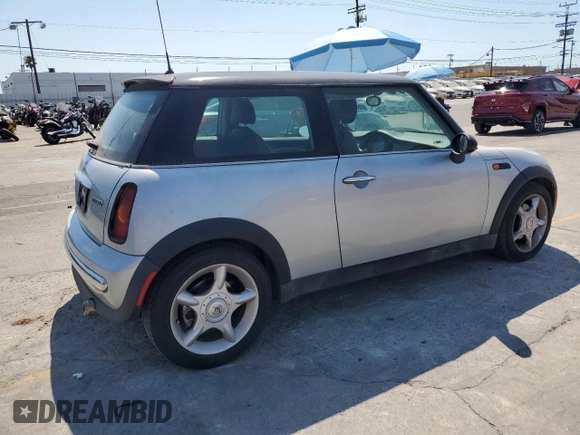 2003 MINI Hardtop with VIN WMWRC33453TE14909, listed as a Copart auction lot 65419725 with 111,960 mi miles and Salvage title. Bid and sale history available at DreamBid. Image 3.