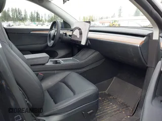 2024 Tesla Model Y Long Range with VIN 7SAYGAEE5RF981789, listed as a IAAI auction lot 41991292 with 21,103 mi miles. Bid and sale history available at carsss.com. Image 5.
