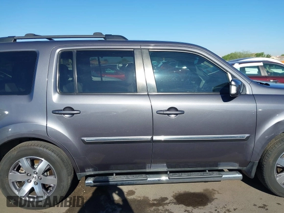 2014 Honda Pilot Touring z VIN 5FNYF4H90EB033259, wystawiony jako IAAI lot #42287774 z przebiegiem 115 416 mil mil oraz . Historia ofert i sprzedaży dostępna na DreamBid. Obrazek 13.