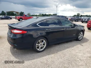 2016 Ford Fusion Titanium Hybrid with VIN 3FA6P0RUXGR204106, listed as a Copart auction lot 62769015 with 106,826 mi miles and Salvage title. Bid and sale history available at DreamBid. Image 3.
