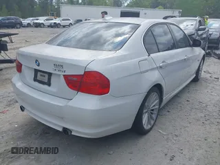 2011 BMW 3 Series 335i with VIN WBAPM5C51BE575704, listed as a IAAI auction lot 42005354 with 205,263 mi miles. Bid and sale history available at carsss.com. Image 4.