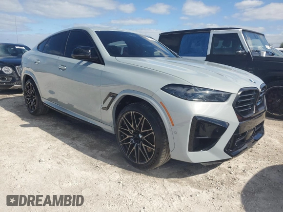 2024 BMW X6 M with VIN 5YM23ET04R9S28947, listed as a Copart auction lot 77666914 with 21,814 mi miles and Non Repairable. Bid and sale history available at carsss.com. Image 4.