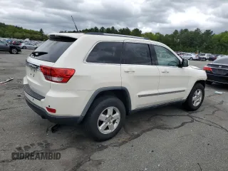 2011 Jeep Grand Cherokee Laredo with VIN 1J4RR4GG9BC515467, listed as a Copart auction lot 58411085 with 112,558 mi miles and Salvage title. Bid and sale history available at DreamBid. Image 3.