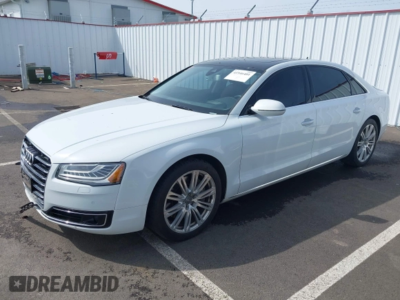 2015 Audi A8 4.0T with VIN WAU32AFD6FN039739, listed as a IAAI auction lot 41946401 with 102,668 mi miles and . Bid and sale history available at DreamBid. Image 2.