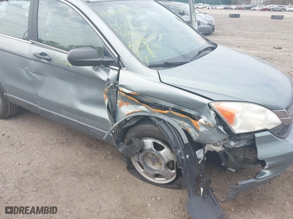 2011 Honda CR-V LX with VIN 5J6RE3H37BL008665, listed as a IAAI auction lot 42060005 with 128,447 mi miles. Bid and sale history available at carsss.com. Image 6.