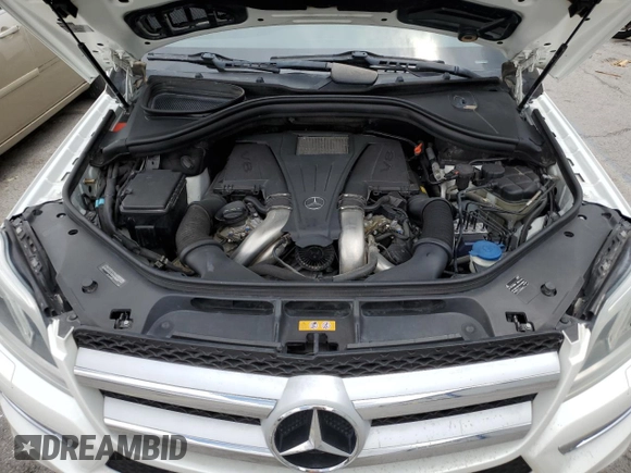 2014 Mercedes-Benz GL 450 z VIN 4JGDF7CE4EA314084, wystawiony jako Copart lot #59593195 z przebiegiem 161 026 mil mil oraz Szkoda całkowita • Salvage title. Historia ofert i sprzedaży dostępna na DreamBid. Obrazek 12.