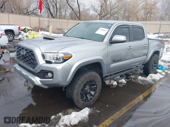 2021 Toyota Tacoma SR z VIN 3TMCZ5AN0MM386867, wystawiony jako IAAI lot #41580426 z przebiegiem 46 559 mil mil oraz . Historia ofert i sprzedaży dostępna na DreamBid. Obrazek 2.
