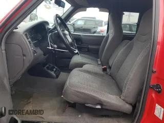 1999 Ford Ranger XLT with VIN 1FTYR14X4XPA57227, listed as a Copart auction lot 80829684 with 166,834 mi miles and Salvage Title. Bid and sale history available at DreamBid. Image 7.
