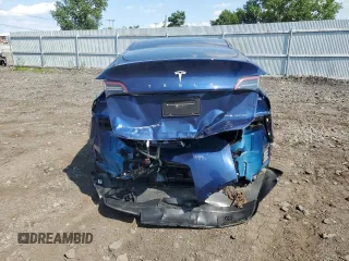 2024 Tesla Model Y Long Range with VIN 7SAYGAEEXRF983702, listed as a Copart auction lot 61536565 with Not provided miles and Salvage title. Bid and sale history available at DreamBid. Image 6.
