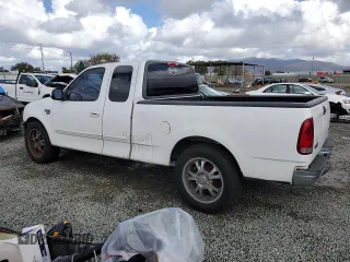 2002 Ford F-150 XL with VIN 1FTRX17W22KC53704, listed as a Copart auction lot 49179545 with 182,629 mi miles and Clean Title. Bid and sale history available at carsss.com. Image 2.