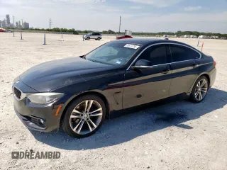 2018 BMW 4 Series 430i with VIN WBA4J1C51JBG79388, listed as a Copart auction lot 56874785 with 100,317 mi miles and Salvage title. Bid and sale history available at DreamBid. Image 1.