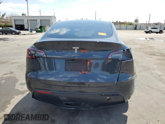 2025 Tesla Model Y Long Range with VIN 7SAYGDED8SF241779, listed as a Copart auction lot 51899205 with 12,409 mi miles and Salvage Title. Bid and sale history available at DreamBid. Image 6.