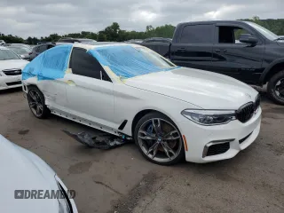 2018 BMW 5 Series M550i xDrive with VIN WBAJB9C5XJB035996, listed as a Copart auction lot 61459425 with Not provided miles and Salvage title. Bid and sale history available at DreamBid. Image 4.
