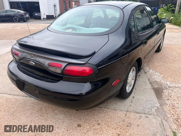 1999 Ford Taurus SE with VIN 1FAFP53SXXA145301, listed as a Copart auction lot 60351535 with 57,262 mi miles and Clean title. Bid and sale history available at DreamBid. Image 4.