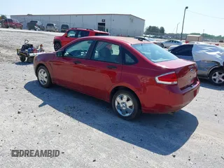 2009 Ford Focus S with VIN 1FAHP34N69W102568, listed as a IAAI auction lot 42137185 with 113,099 mi miles. Bid and sale history available at carsss.com. Image 3.