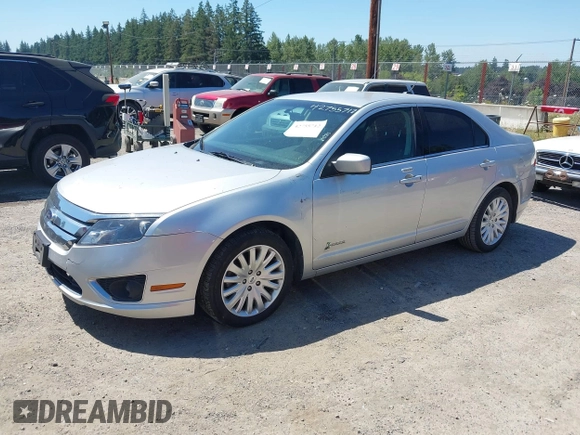 2012 Ford Fusion Hybrid z VIN 3FADP0L3XCR380817, wystawiony jako IAAI lot #42755712 z przebiegiem 81 220 mil mil oraz . Historia ofert i sprzedaży dostępna na DreamBid. Obrazek 2.