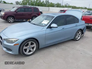 2013 BMW 3 Series 320i with VIN WBA3B1C54DK128284, listed as a IAAI auction lot 40315808 with 136,104 mi miles. Bid and sale history available at carsss.com. Image 2.