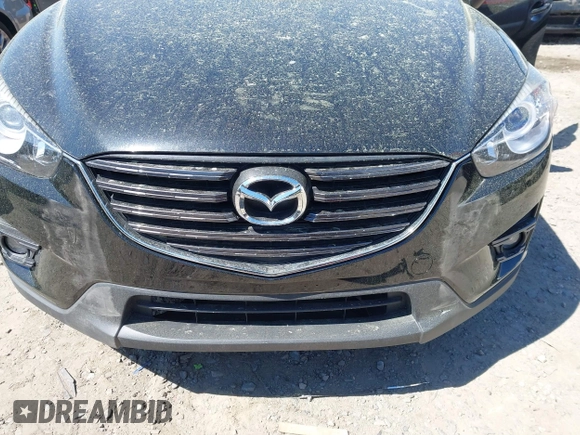 2016 Mazda CX-5 Grand Touring with VIN JM3KE4DY9G0893174, listed as a IAAI auction lot 41887814 with 79,811 mi miles. Bid and sale history available at carsss.com. Image 6.