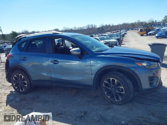 2016 Mazda CX-5 Grand Touring with VIN JM3KE2DY2G0715272, listed as a IAAI auction lot 41590492 with 134,176 mi miles. Bid and sale history available at carsss.com. Image 14.