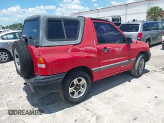 2002 Chevrolet Tracker z VIN 2CNBE18C926911755, wystawiony jako IAAI lot #42452154 z przebiegiem 129 098 mil mil oraz . Historia ofert i sprzedaży dostępna na DreamBid. Obrazek 4.