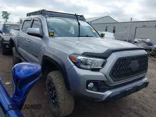 2019 Toyota Tacoma SR with VIN 3TMCZ5AN5KM261196, listed as a IAAI auction lot 42145107 with 62,754 mi miles and . Bid and sale history available at DreamBid. Image 1.