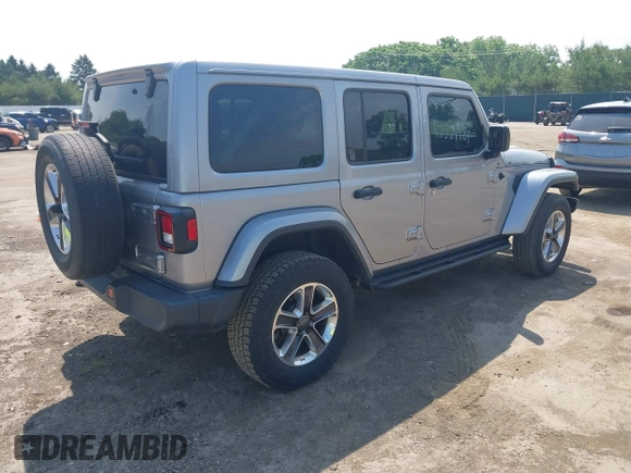 2019 Jeep Wrangler Unlimited Sahara with VIN 1C4HJXEN5KW542403, listed as a IAAI auction lot 42524989 with 60,451 mi miles and . Bid and sale history available at DreamBid. Image 4.