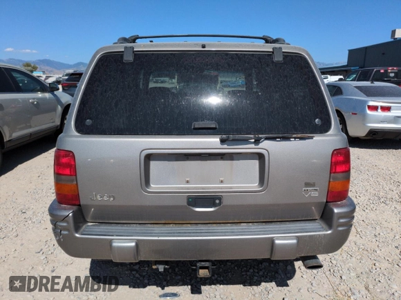 1998 Jeep Grand Cherokee Limited z VIN 1J4GZ88Z8WC306919, wystawiony jako Copart lot #61505725 z przebiegiem 195 329 mil mil oraz Czysty tytuł • Clean title. Historia ofert i sprzedaży dostępna na DreamBid. Obrazek 6.