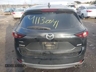 2018 Mazda CX-5 Touring z VIN JM3KFACM3J1435089, wystawiony jako IAAI lot #41130041 z przebiegiem 80 446 mil mil oraz . Historia ofert i sprzedaży dostępna na DreamBid. Obrazek 16.