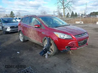 2015 Ford Escape Titanium with VIN 1FMCU9J91FUB13990, listed as a IAAI auction lot 41250985 with 114,810 mi miles and . Bid and sale history available at DreamBid. Image 1.