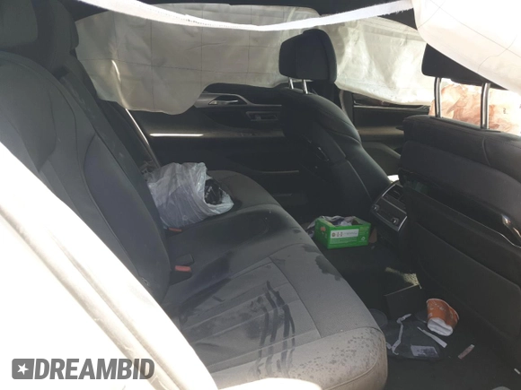 2020 BMW 7 Series 740i z VIN WBA7T2C09LCD15735, wystawiony jako Copart lot #54098325 z przebiegiem Nie podano mil oraz Szkoda całkowita • Salvage title. Historia ofert i sprzedaży dostępna na DreamBid. Obrazek 10.