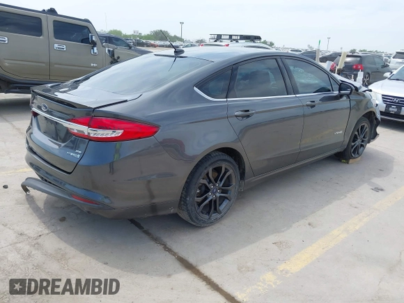 2018 Ford Fusion Hybrid SE with VIN 3FA6P0LU1JR116139, listed as a IAAI auction lot 41933594 with 83,000 mi miles. Bid and sale history available at carsss.com. Image 4.