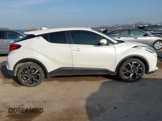 2021 Toyota C-HR LE with VIN JTNKHMBXXM1099019, listed as a IAAI auction lot 41525170 with 63,519 mi miles. Bid and sale history available at carsss.com. Image 13.