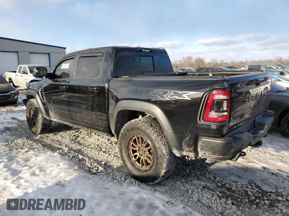 2021 Ram 1500 TRX with VIN 1C6SRFU9XMN704748, listed as a Copart auction lot 89356555 with 104,286 mi miles and Salvage Title. Bid and sale history available at carsss.com. Image 2.